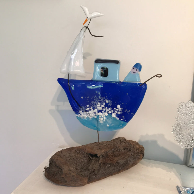 Glass Fishing Boat on Driftwood Block with sailor and seagull - Studio Shards